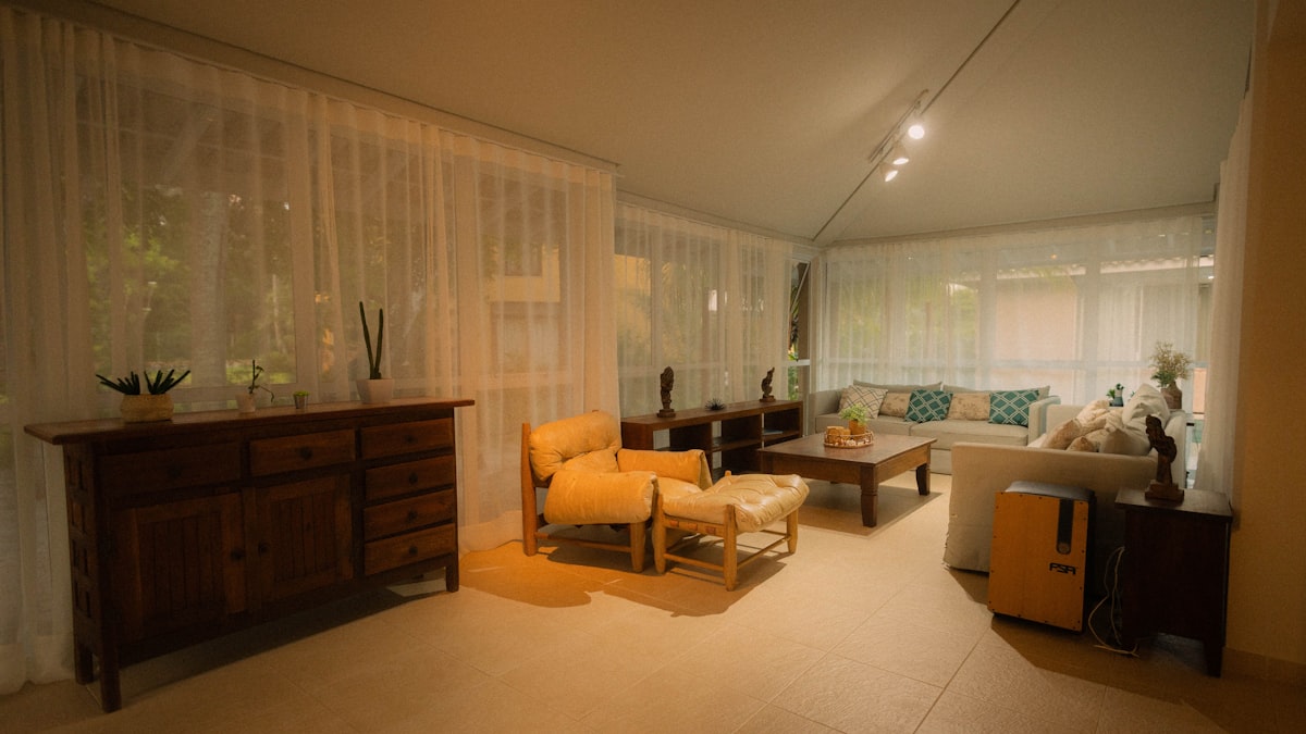 A well-lit living room with modern furniture. related to Window Valance Ideas for Living Room