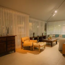 A well-lit living room with modern furniture. related to Window Valance Ideas for Living Room