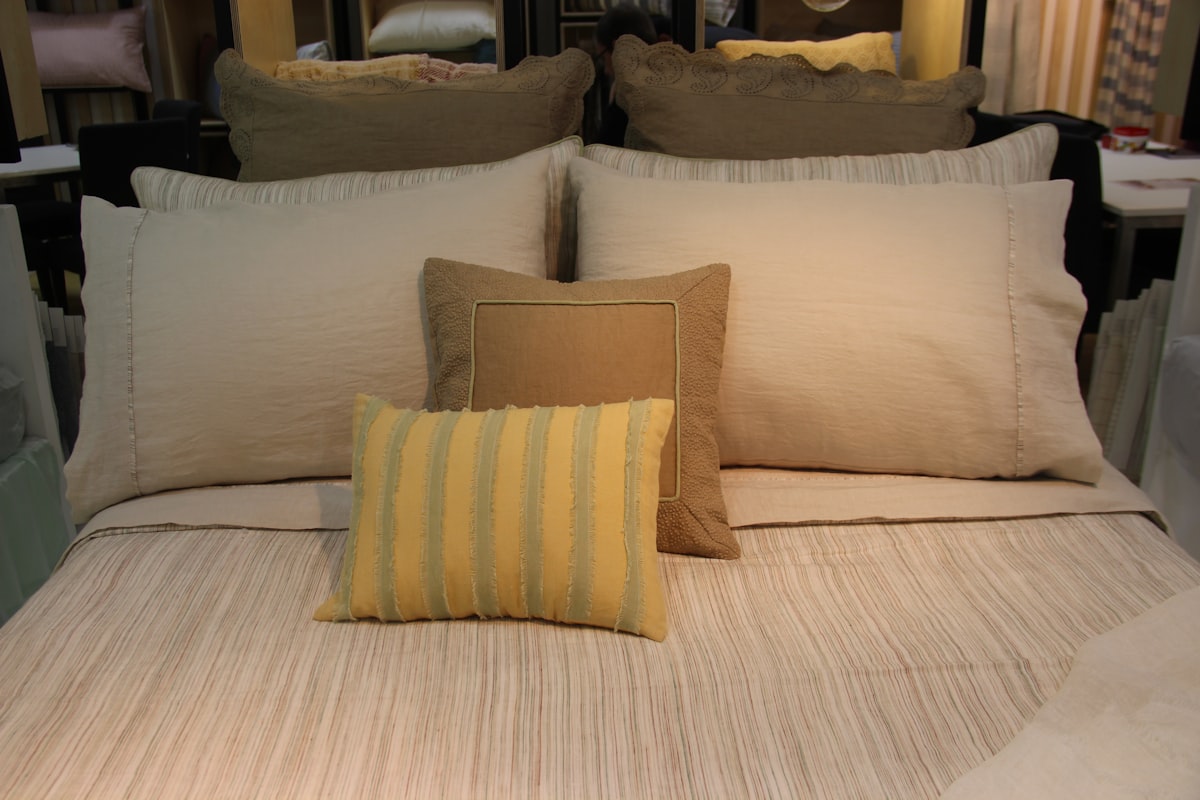 A well-made bed with fluffy pillows. related to King Size Coverlet Sets for a Luxurious Bed