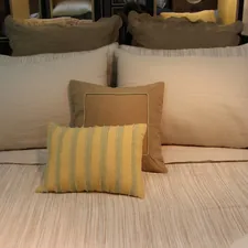A well-made bed with fluffy pillows. related to King Size Coverlet Sets for a Luxurious Bed