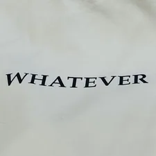 a white bag with the word whatever printed on it related to What is a Bed Coverlet?