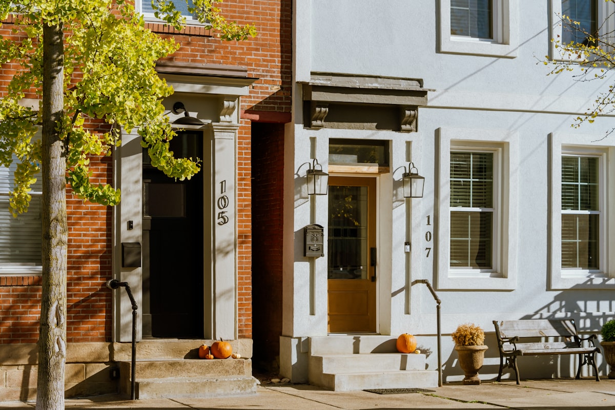A white building with a brown door and windows related to Sleep in Historic Charm: Bed & Breakfasts of Pennsylvania