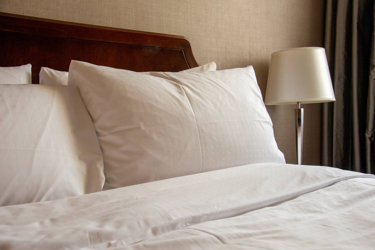 A white pillow in hotel related to Hotel Collection Coverlet