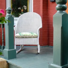a white rocking chair sitting on a porch related to Cozying Up in Virginia: Top Bed and Breakfast Options