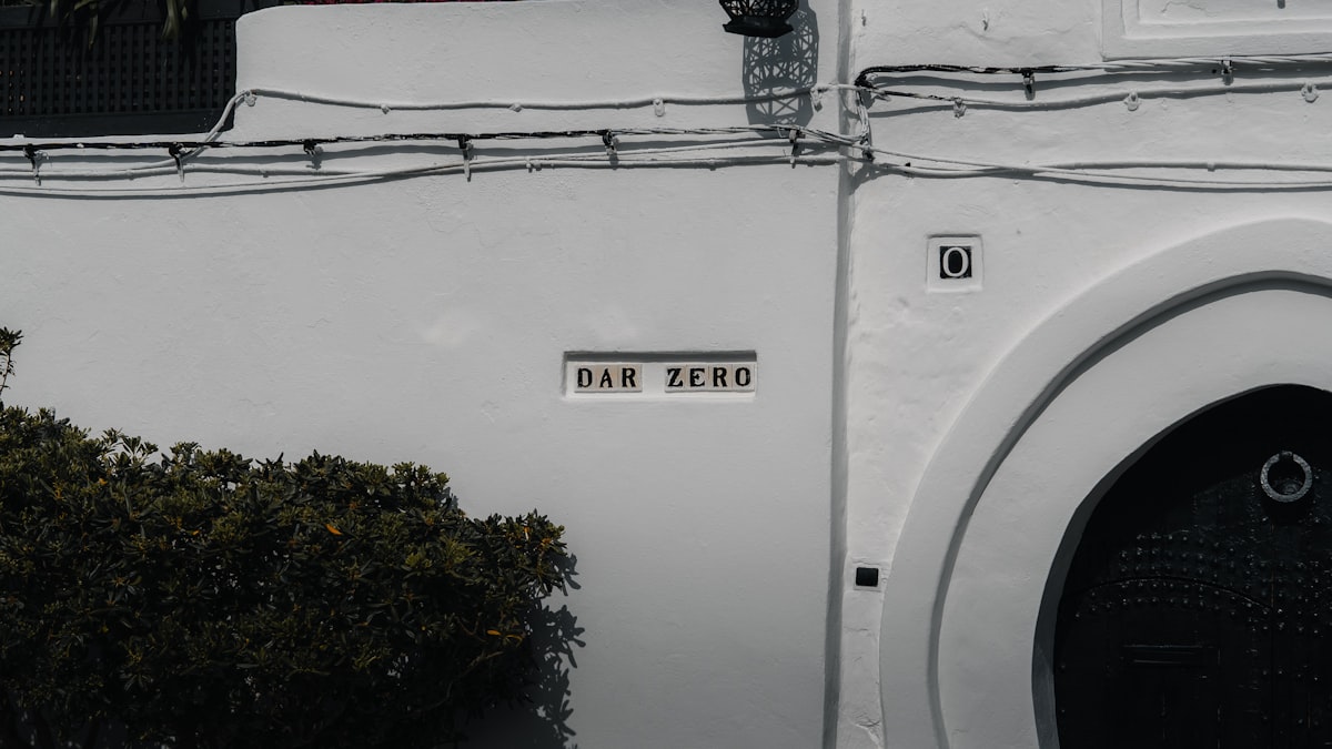 A white wall with a sign and an arch. related to Score Big with Bed Bath and Beyond Clearance Sales