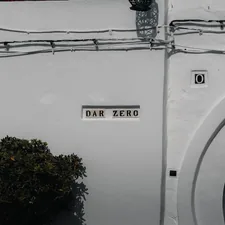 A white wall with a sign and an arch. related to Score Big with Bed Bath and Beyond Clearance Sales