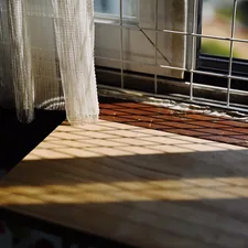 a window sill with a curtain and a window sill in the background related to Faux Wood Valance Ideas for Your Home