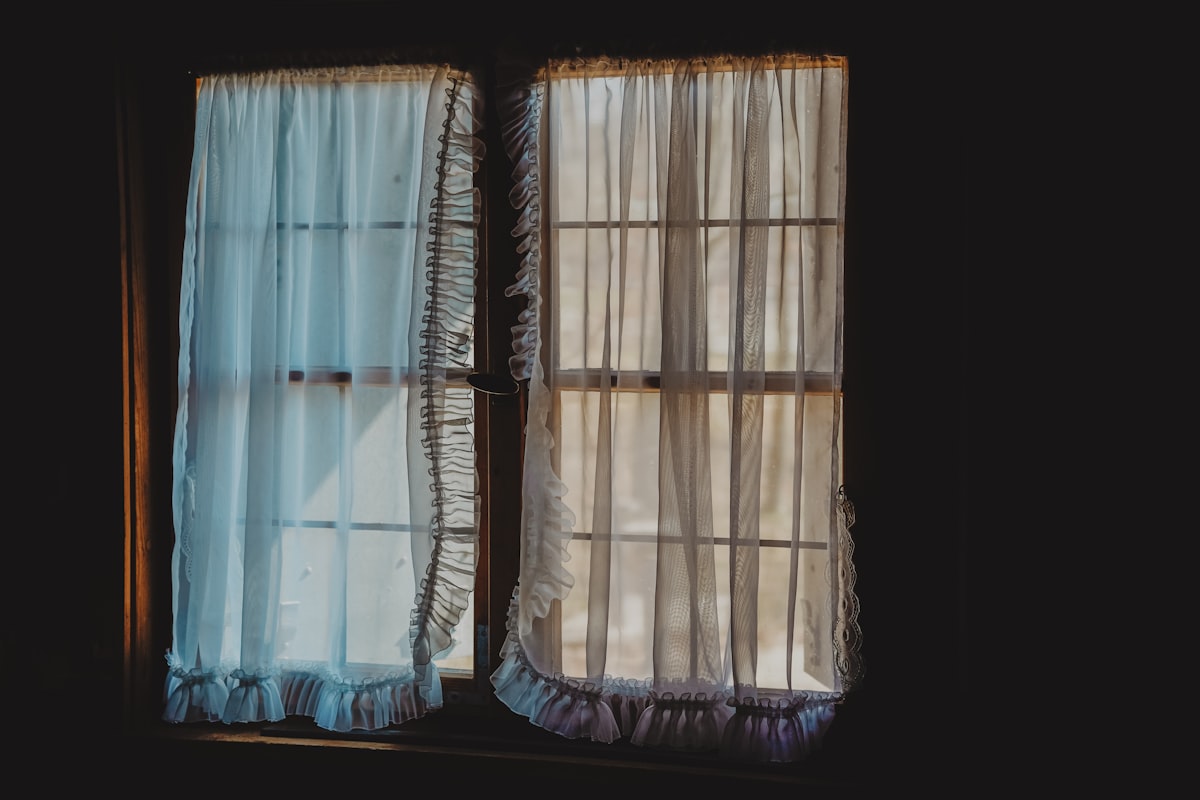 a window that has a curtain in it related to Curtain Valance Set: Elevate Your Home Decor