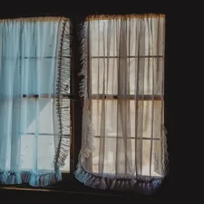 a window that has a curtain in it related to Curtain Valance Set: Elevate Your Home Decor