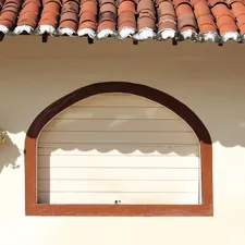 a window with a potted plant on the side of it related to Wood Window Valence Ideas