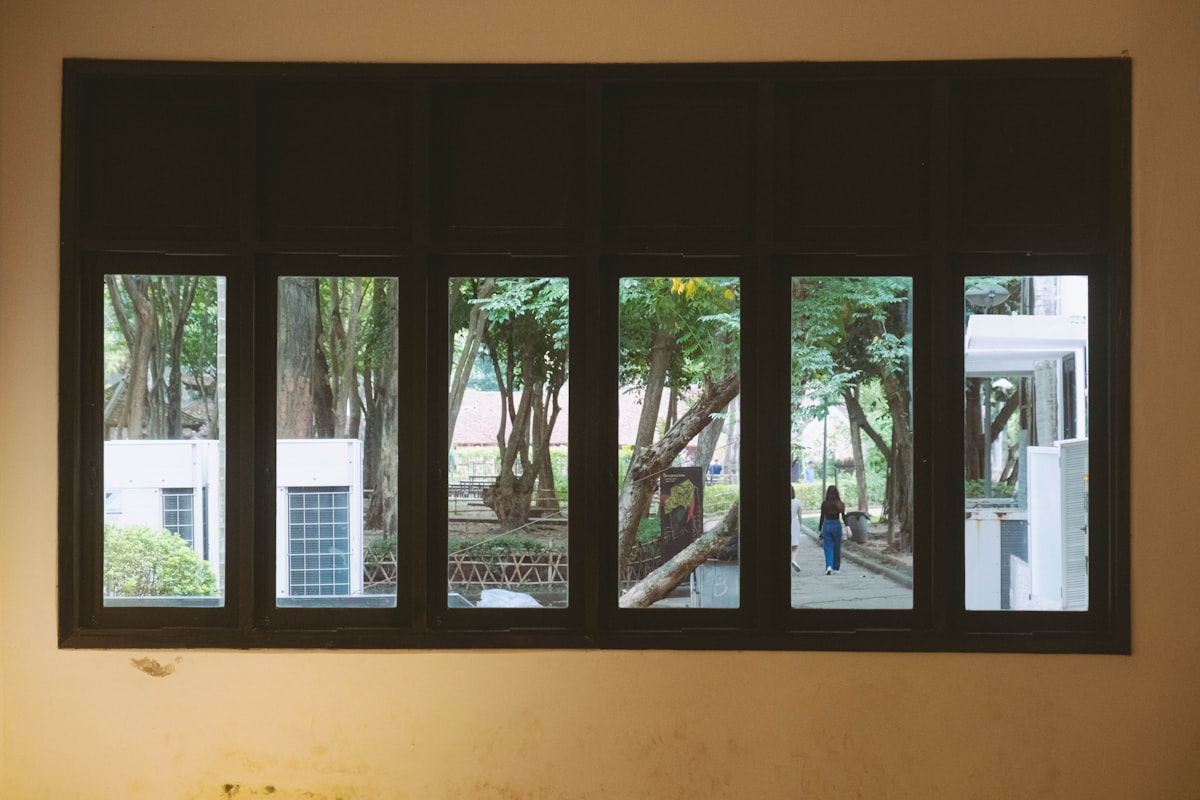 a window with a view of a tree outside related to Black Window Valance