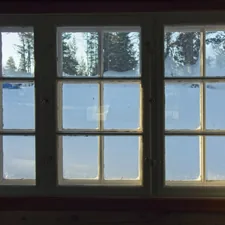 a window with a view of the snow outside related to Elevate Your Windows: The Ultimate Guide to Window Blind Valances