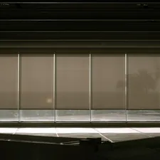 a window with blinds in a dark room related to Mastering Valance Window Treatments: A Guide to Measuring Like a Pro