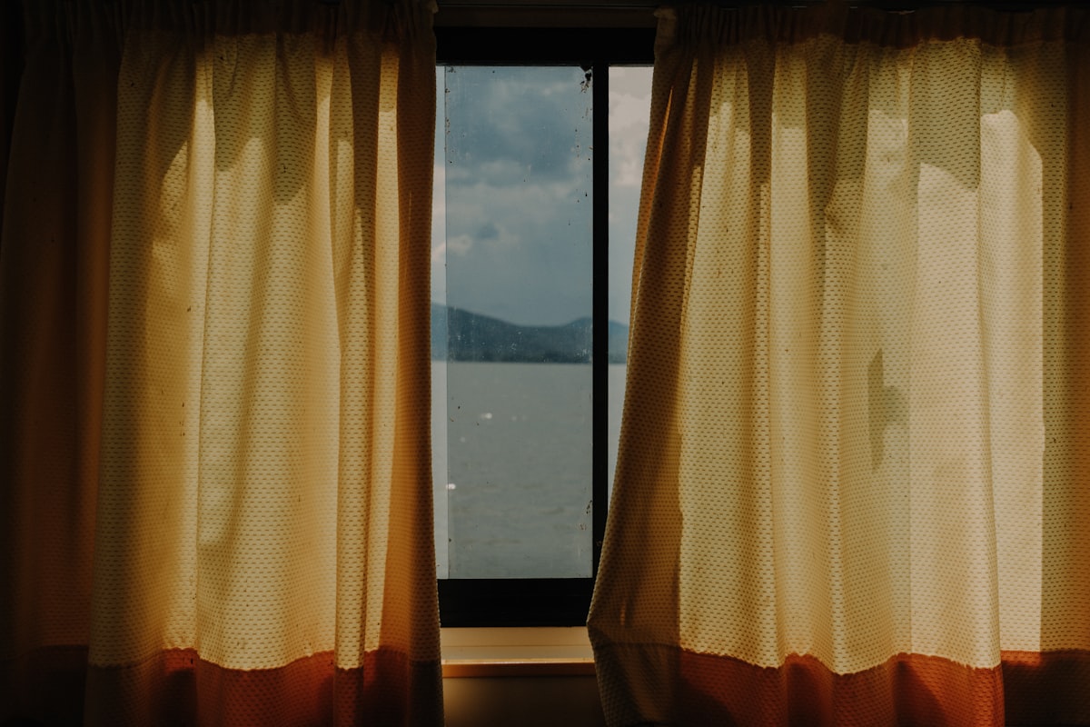 a window with curtains related to Elevate Your Windows with Curtains, Valances, and Swags