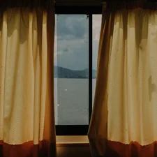 a window with curtains related to Elevate Your Windows with Curtains, Valances, and Swags