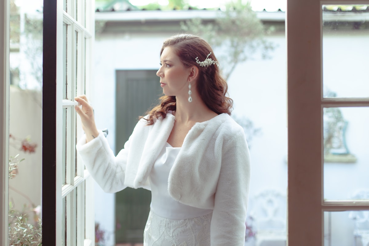 a woman in a white dress related to A Touch of Timeless Elegance: Styling White Lace Valances