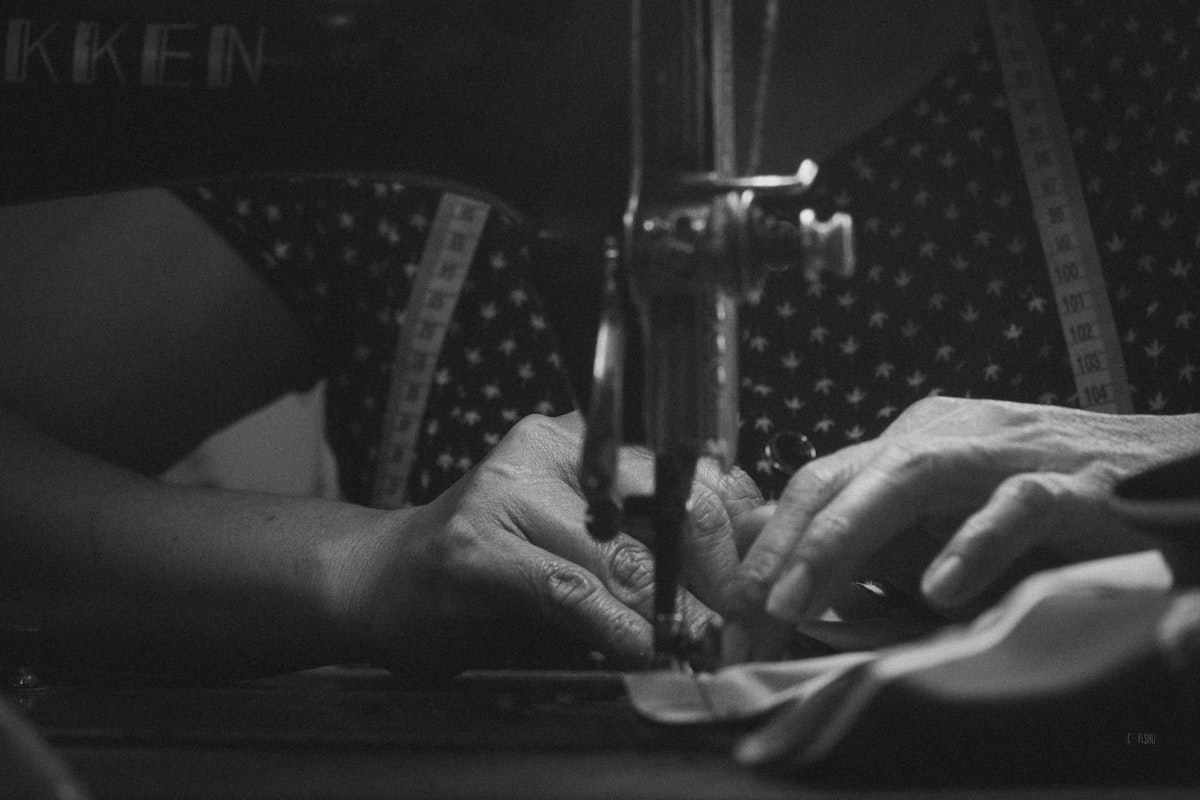 a woman is using a sewing machine to sew related to How to Make No Sew Valances