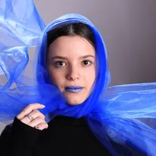 a woman with a blue scarf around her head related to Sheer Scarf Valances