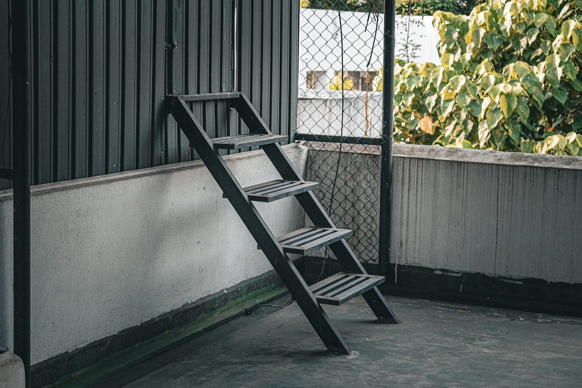 A wooden ladder leans against a wall. related to Assembling the Perfect Bunk Bed: A Step-by-Step Guide