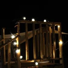 a wooden structure with some lights on it related to How to Create a Magical DIY Canopy Bed with Lights