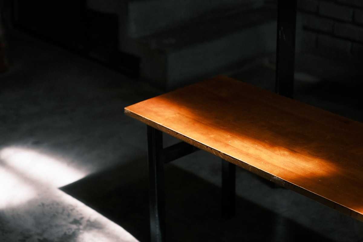 A wooden table sitting in the middle of a room related to Stylish and Functional Oak Entryway Tables to Elevate Your Home's Entrance
