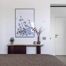 Accent colors—primarily deep red and rust—are introduced through furniture and textiles, adding visual contrast without disrupting the overall balance. related to Sleek and Sophisticated: The Ultimate Guide to Mid Century Modern Beds