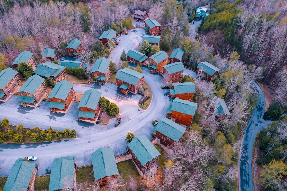 aerial view of houses and trees during daytime related to Snuggle Up in Gatlinburg: A Guide to Cozy Bed & Breakfasts