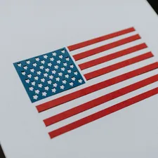 American flag cut out of paper related to Patriotic Bedding: The Best Bedding Made in USA