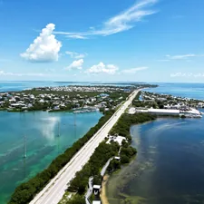 an aerial view of a highway and a body of water related to Discover the Charm of Bed and Breakfasts in the Florida Keys