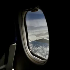 an airplane window looking out at the earth related to Valances for Wide Windows: Perfecting Your View