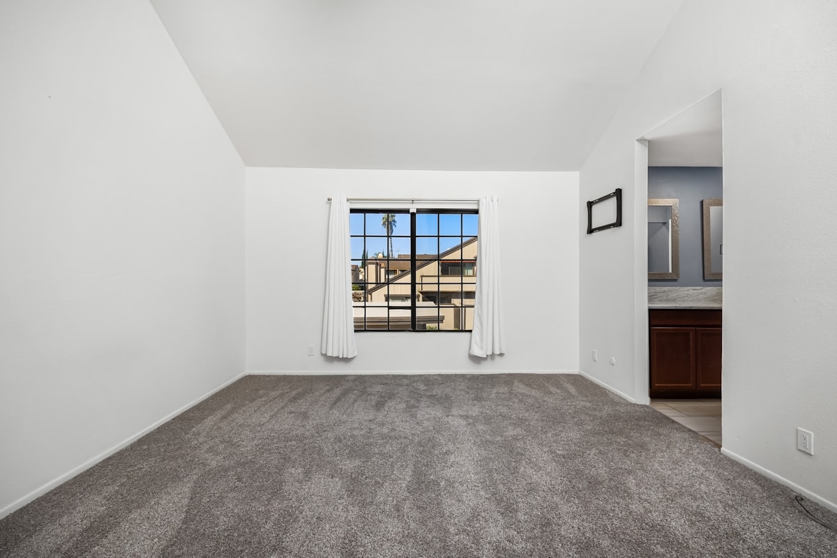 An empty living room with a large window related to Discover the Perfect 2 Bed 2 Bath Home: Features, Benefits, and More