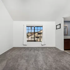 An empty living room with a large window related to Discover the Perfect 2 Bed 2 Bath Home: Features, Benefits, and More
