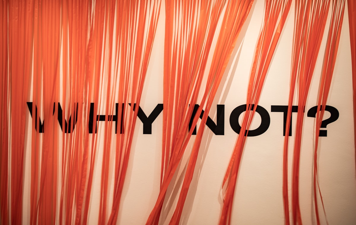 an orange curtain with the words why why on it related to What is a Valance?