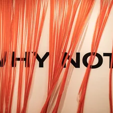 an orange curtain with the words why why on it related to What is a Valance?