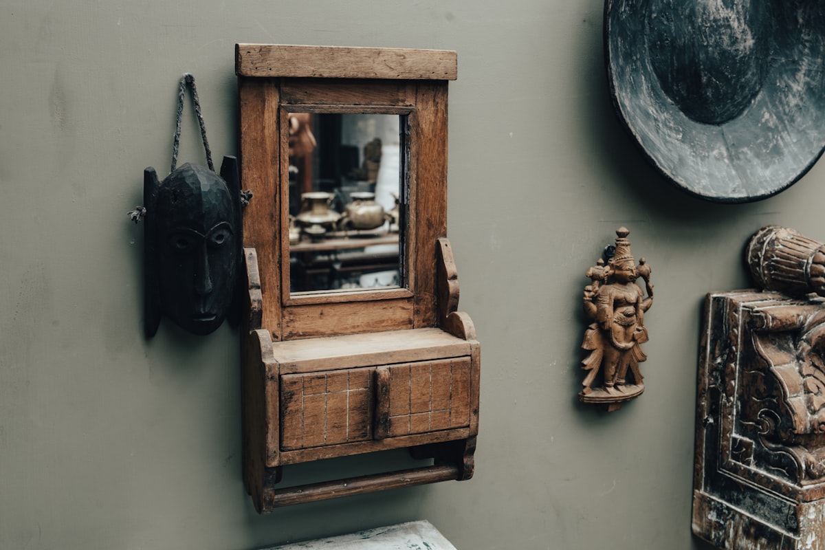 Antique mirror and wooden decorations on a wall. related to The Timeless Beauty of Antique Oak Sideboards with Mirrors