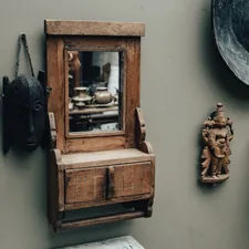 Antique mirror and wooden decorations on a wall. related to The Timeless Beauty of Antique Oak Sideboards with Mirrors