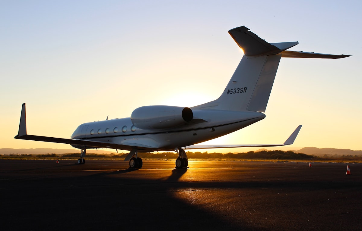 architectural photography of white aircraft related to Private Jet with Bed: The Ultimate Comfort at the Sky