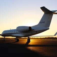 architectural photography of white aircraft related to Private Jet with Bed: The Ultimate Comfort at the Sky