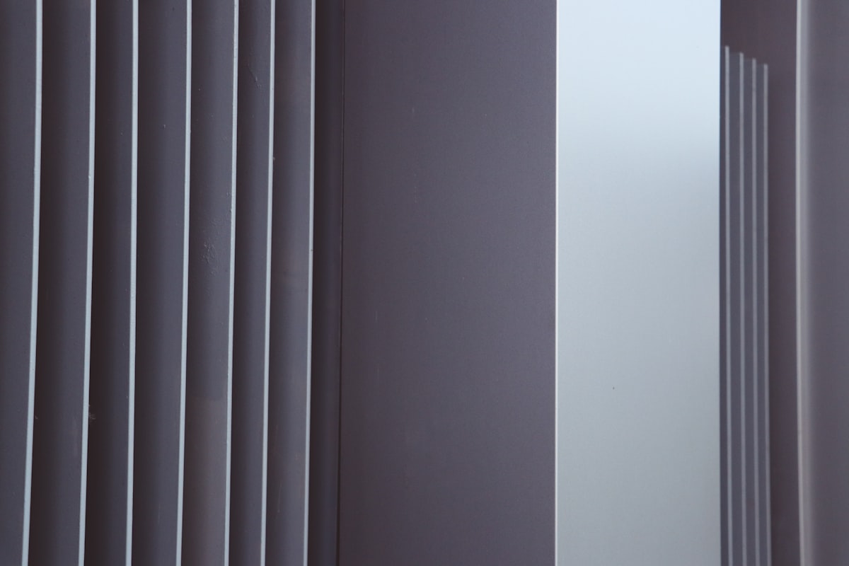 architecture, background, business, sky, city, light, blue, silhouette, glass, beautiful, new, futuristic, cityscape, facade, property, commercial, capital, reflection, modernism, downtown, tower, district, estate, exterior, high, panorama, view related to How to Choose the Right Vertical Valance Clips