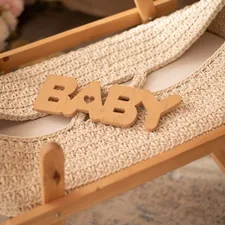 Baby's cradle is ready for a newborn. related to The Ultimate Guide to Baby Beds for Dolls: Choosing the Perfect Miniature Crib
