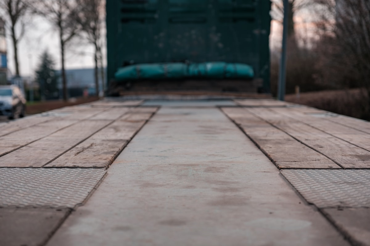 backside of a trailer connected to a 18 wheeler related to The Ultimate Protection: Rubber Truck Bed Mats