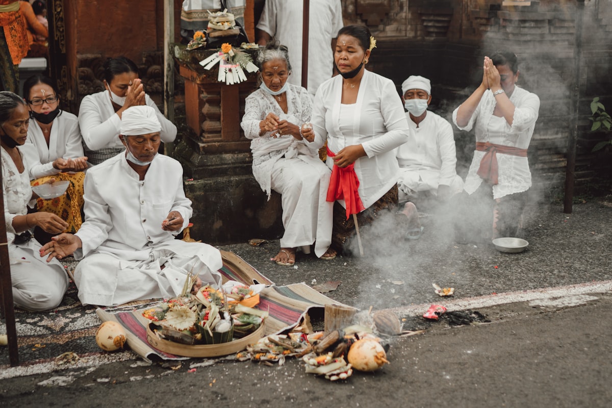 Balinese people during Hindu ceremony related to The Warmth of Tradition: Benefits of Large Terracotta Chimineas