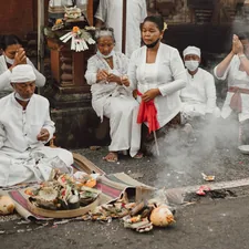 Balinese people during Hindu ceremony related to The Warmth of Tradition: Benefits of Large Terracotta Chimineas