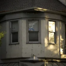 Bay window on an old house at sunset related to Bay Window Valance