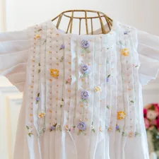 Beautiful girl dress for special occasions related to The Chic Touch: Lombardi Smocked Coverlet Decorating Ideas