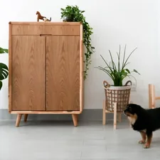 black and brown short coated dog sitting on brown wooden chair related to Danish Modern Sideboard