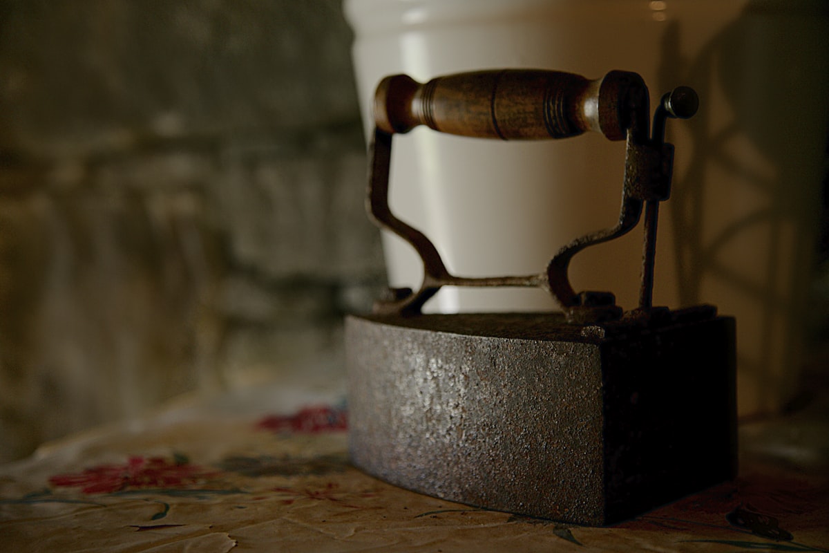 black and gray metal machine part related to The Warmth of the Past: Uncovering the Charm of Antique Bed Warmers