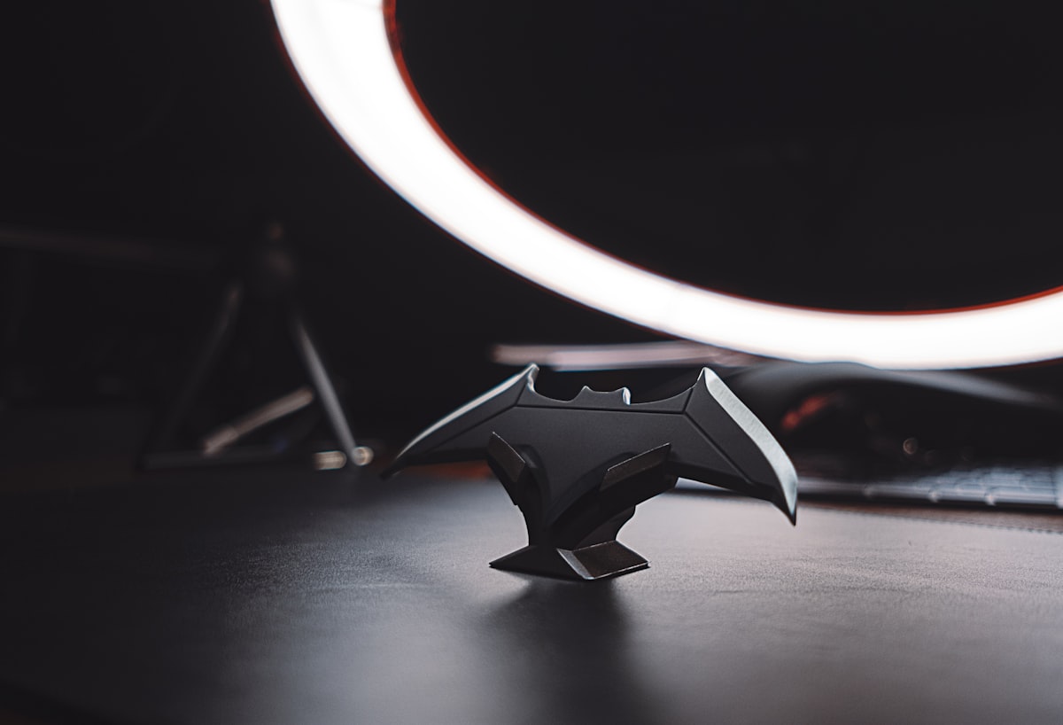 black and silver star ornament related to Sleep Like a Superhero: The Ultimate Batman Twin Bed Frame Guide