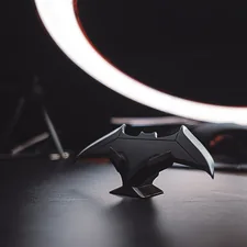 black and silver star ornament related to Sleep Like a Superhero: The Ultimate Batman Twin Bed Frame Guide