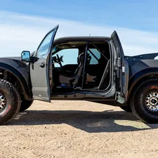 black classic car on brown sand during daytime related to UPOL Raptor Bed Liner: The Ultimate Protection for Your Truck